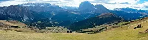 Alto Adige Prints: Couple sitting overlooking Dolomites in European Alps. Gardena Pass, Italy