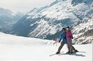 Young Couple Prints: A Couple Skiing In The French Alps; Chaminox-Mont-Blanc Rhone-Alpes France