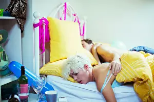 Fatigue Prints: Couple sleeping in bed the morning after a party