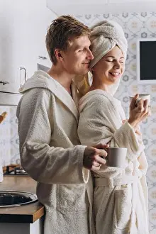 Generation X Prints: A couple in white terry bathrobes with cups in their hands