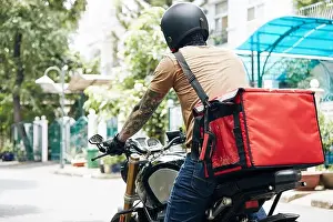 Mode Of Transport Prints: Courier with big thermal bag riding on motorcycle when delivering food to customers