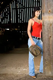 Tank Top Prints: Cowgirl in barn doorway with hat and tank top