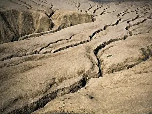 Dramatic Landscape Prints: Cracked earth shaped by mud volcanoes