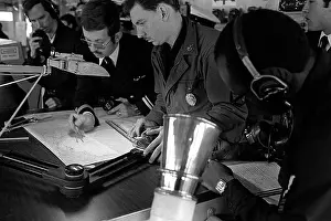 6th Fleet Prints: Crewmen aboard the destroyer USS JOHN HANCOCK (DD-981) plot the ship's course during operations with the U