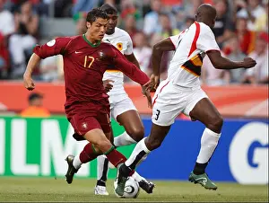 Cristiano Ronaldo of Portugal drives the ball during a FIFA World Cup soccer match against Angola June 11, 2006