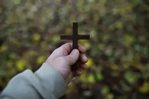 Glory Prints: The cross of God in the rays of the sun. Background religions
