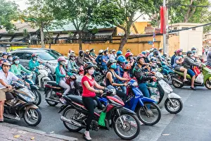 Ho Chi Minh City Prints: Crowd of scooter riders waiting at traffic light, Ho Chi Minh City, Vietnam
