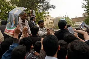 City Street Prints: A crowd of supporters hold up posters of President Mahmoud Ahmadinejad during his provincial tour in Qazvin