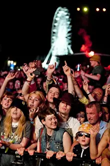Performs Prints: The crowd watch The Stone Roses performing at the Isle of Wight Festival