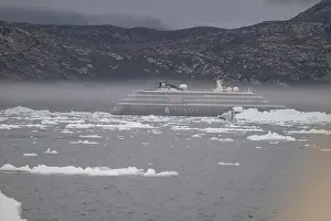 Polar Regions Prints: Cruise ship floating between the icebergs near the Eqi glacier