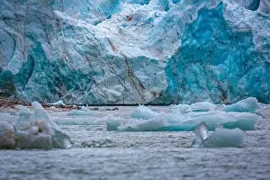 cruising in the Arctic in the Magdalensfjord on Svalbard along a glacier