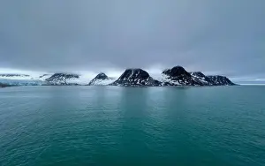 Grey Clouds Prints: cruising in the Arctic in the Magdalensfjorden on Svalbard, Norway