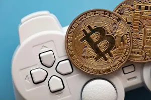 Joystick Prints: Crypto gaming concept. Video game controller with a bitcoin cryptocurrency coin