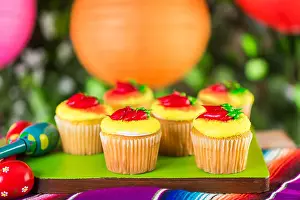 Mexican Prints: Cupcakes decorated with red chili peppers for Cinco de Mayo.
