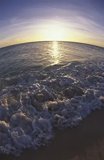 Wide Angle Prints: Curved horizon and sunset over beach, waves and ocean