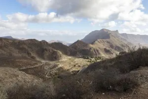 Canaries Prints: Curved winding road, GC-60, between big mountains in Gran Canaria, Spain
