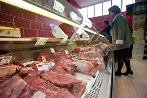 Customers Prints: Customers choose their Halal meat at a Halal supermarket in Nantes, France
