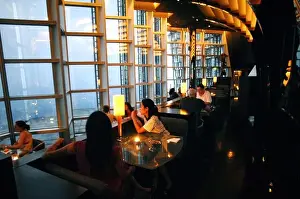Customers are pictured at Cloud 9 Bar in the Grand Hyatt Shanghai in Jinmao Tower in the Lujiazui Financial District in