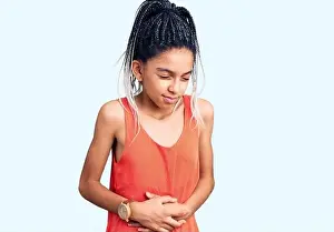 Suffer Prints: Cute african american girl wearing casual clothes with hand on stomach because indigestion