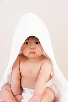 Diaper Prints: Cute Asian baby sitting with a towel over his head