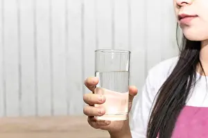Young Girl Prints: Cute asian young woman drink water from glass