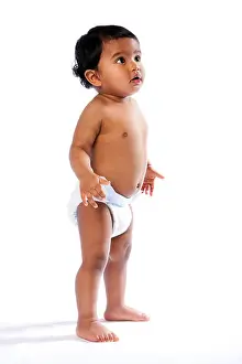 Diaper Prints: Cute baby toddler standing and looking amazed surprised up wearing diaper
