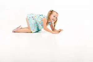 Crawl Prints: cute beautiful little blonde girl crawls on her knees