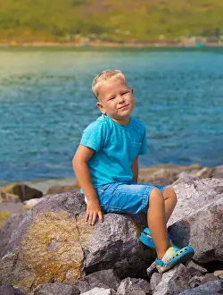 Rock River Prints: Cute caucasian boy at seaside