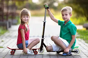 Scooter Prints: Two cute happy funny smiling young children