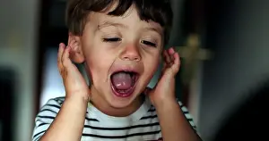 Cute little boy face adorable playful child