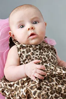 Normal Prints: Cute newborn baby girl in leopard print dress, young fashionista