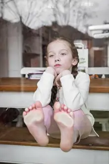 Head In Hands Prints: Cute pretty young girl looking out of window bored frustrated fed up resting head in hands