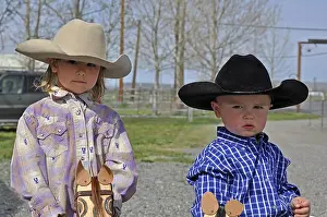 Toddlers Prints: This cute young boy and girl siblings are wearing cowboy hats