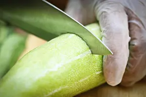 Gourd Prints: Cutting snake gourd with kitchen knife
