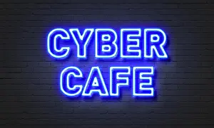 Lease Prints: Cyber cafe neon sign on brick wall background