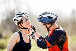 Beauty Day Prints: Cyclists in helmets at park