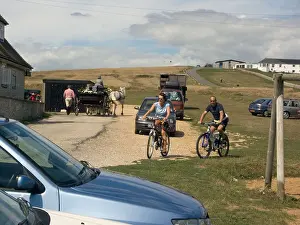 Cyclists Prints: Cyclists and Horse Drawn Carriage handsome carriage at The Pulpit Inn Portland Bill Dorset England UK English