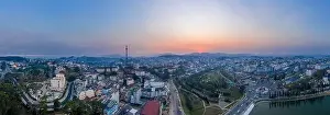 Da Lat or Dalat, Vietnam evening sunset panorama including City Center, mini Eiffel Tower, Alpine Lake, and Mountains