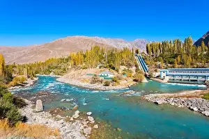 Panj Prints: Dam on the Ghunt river and Pamir mountains aerial panoramic view