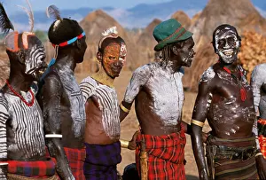 Make Up Prints: At a dance in the Karo village of Duss men stand waiting to dance