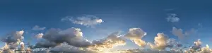 Dark blue evening sky panorama with Cumulus clouds