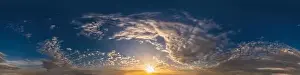 Dark blue sunset sky pano with Cumulus clouds