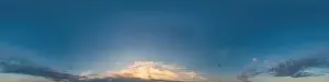 Dark blue sunset sky pano with Cumulus clouds