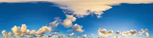 Dark blue sunset sky panorama with Cumulus clouds
