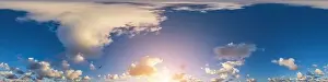 Dark blue sunset sky panorama with Cumulus clouds