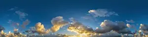 Dark blue sunset sky panorama with Cumulus clouds
