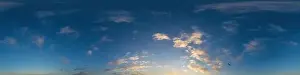 Dark blue sunset sky panorama with Cumulus clouds