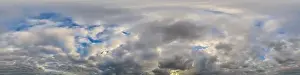 Dark blue sunset sky panorama with Cumulus clouds