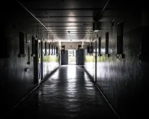 Open Door Prints: A dark corridor in the main prison complex on Robben Island