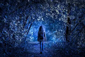 Midnight Prints: Dark forest on Halloween, young woman in fantasy spooky woods at night